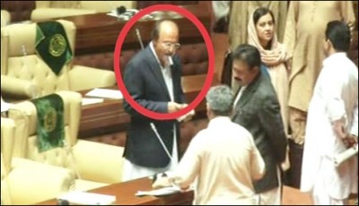 Nisar Khuhro smoking