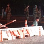 Turkish security officers detain unknown individuals on the side of the road on July 15, 2016 in Istanbul, during a security shutdown of the Bosphorus Bridge.