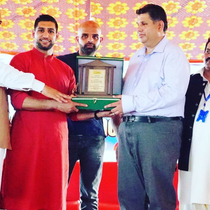 Amir Khan being presented shield by Principal of Blind School at Mirpur AK
