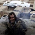 Iranian citizens living on the grave-like holes