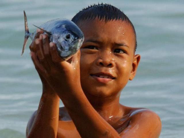 childrens Look like fish swimming in the sea