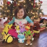 Baby sleeping mother's thumb on the phone order to get toys online