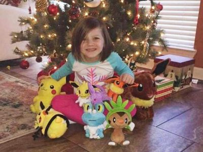 Baby sleeping mother's thumb on the phone order to get toys online