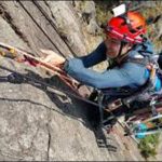 Sit on Wheel chair at climbing the 500-meter high rock