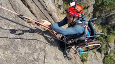 Sit on Wheel chair at climbing the 500-meter high rock