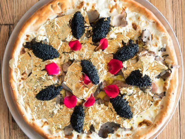 Pizza wrapped in gold foil