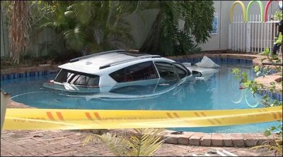 Australia: The woman plunge into the swimming pool with her new car