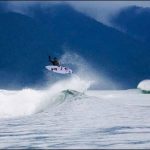 Adventure enthusiasts player tricks on sharp sea waves