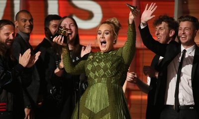Adele breaks the Grammy for Record of the Year for "Hello" after having it presented to her at the 59th Annual Grammy Awards in Los Angeles, California, U.S., February 12, 2017. REUTERS/Lucy Nicholson