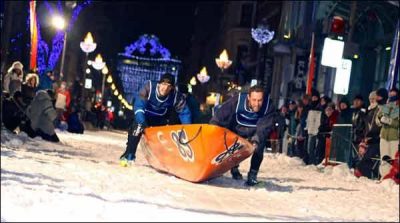 Races of small boats conducting on ice in Quebec City