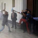Government supporters prostrate on the assembly, opposition members were injured in Venezuela