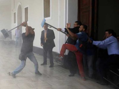 Government supporters prostrate on the assembly, opposition members were injured in Venezuela