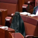 A female member wearing burqa arrives in Australian Parliament