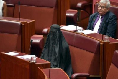 A female member wearing burqa arrives in Australian Parliament