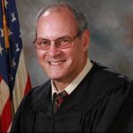 Outside of the American court the attacker was shot dead from the firing of injured judge