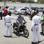 Having a motorcycle riding without a helmet in Karachi is be smart