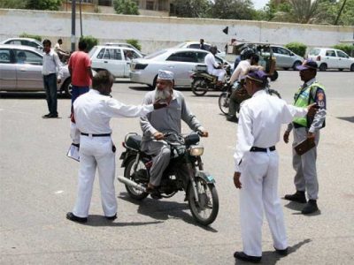 Having a motorcycle riding without a helmet in Karachi is be smart