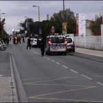 FRANCE: A person carries car on 3 Chinese students
