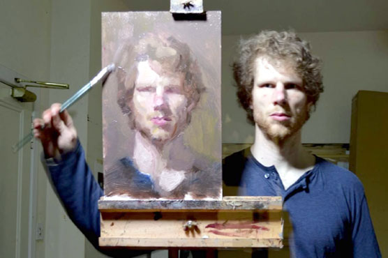 Expert artist, looking at mirror, made his own portrait