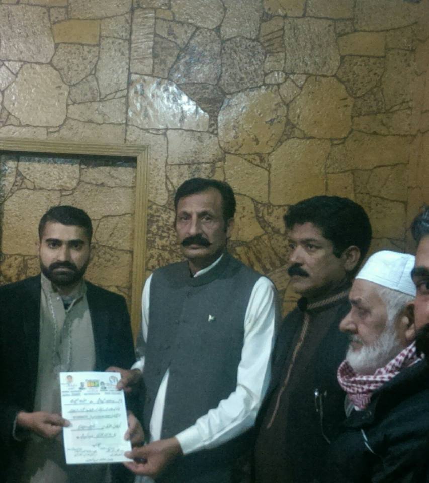 Divisional, Joint, Secretary, receiving, his, Notification, from, Raja Faiz Akber and Raja Imran Haider Advocate