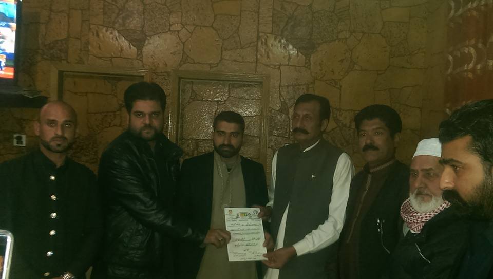 Divisional, Joint, Secretary, receiving, his, Notification, from, Raja Faiz Akber and Raja Imran Haider Advocate