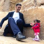The world's tallest person and 2 feet women