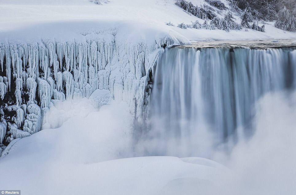 Canada: Charming view of a 21 meter high frozen waterfalls
