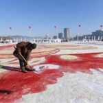 Preparing the biggest snow painting on river
