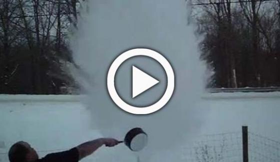 Boiling water freezing in mid air