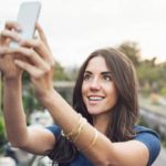Why does the nose appear spread out in the selfie?