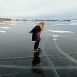 76-year-old woman crossing the frozen lake by skating daily