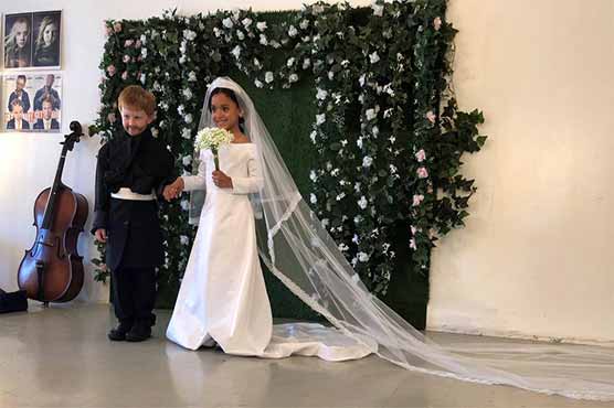 British Prince Harry and Magnal Merkel's tiny version of the wedding came